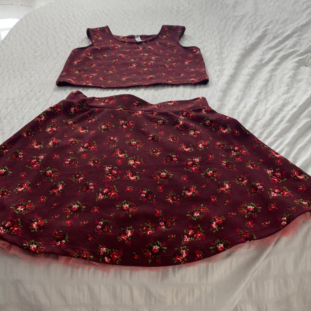 Beautees size(14) it’s maroon two-piece with pink flowers